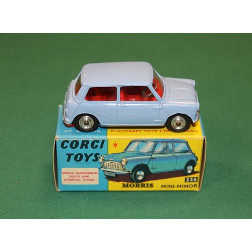 394 - Corgi Toys Morris Mini Minor (226). An example in lilac blue with red interior, a factory error exam... 