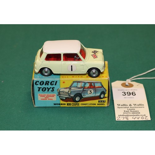 396 - Corgi Toys Morris Mini Cooper Competition Model (227). In yellow with white roof, crossed flags to b... 