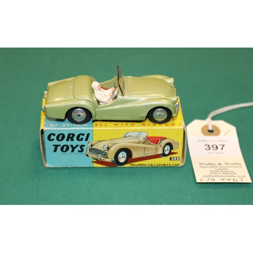 397 - Corgi Toys Triumph TR3 (305). In metallic green with red seats, with screen and racing driver figure... 