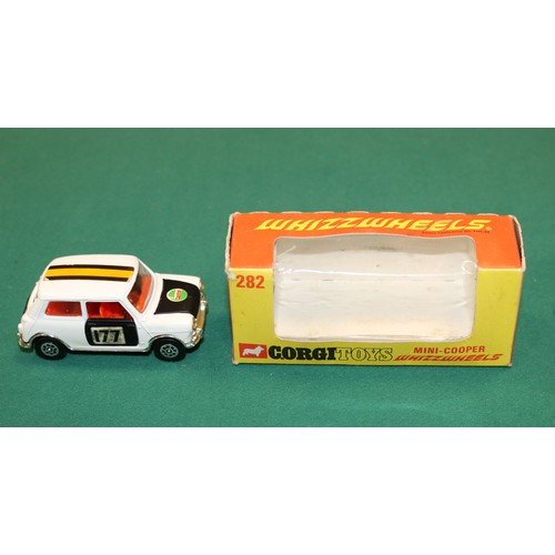 416 - Corgi Toys Whizzwheels Mini-Cooper (282). In white with black bonnet, doors and boot lid, with red i... 