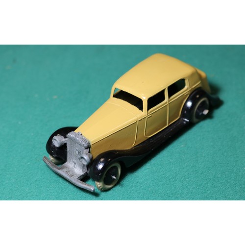 303 - Dinky Toys 30 Series Daimler (30C). A 1936-1940 example with tan body open black chassis, thin axles... 