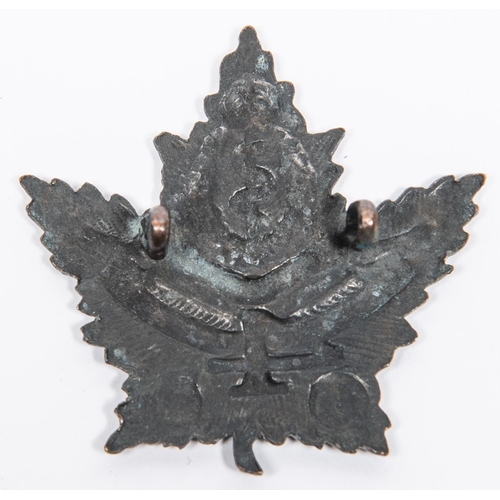 213 - WWI CEF 4th Canadian Field Ambulance blackened cap badge.GC £80-100