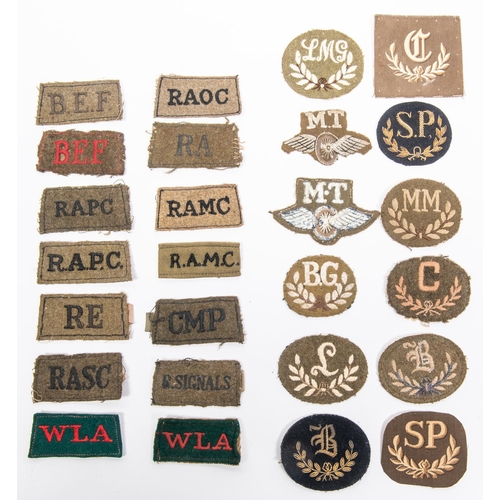 240 - WWII British slip on titles including BEF (2), WLA (2) and other corps  plus a selection of trade ba... 