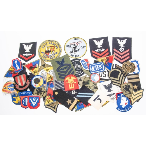 273 - A mixed lot of 50+ US insignia, WWII plus post war army, navy etc. £50-80