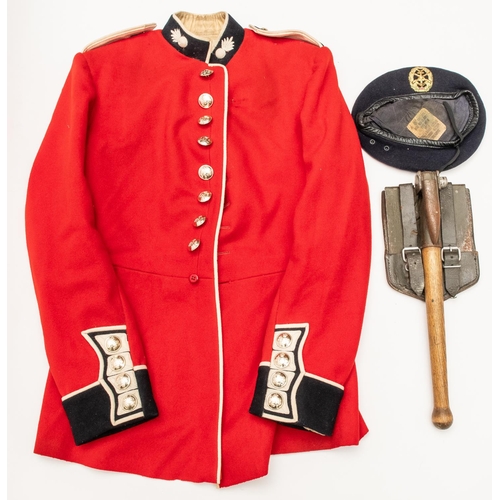 281 - A Grenadier Guards OR's scarlet tunic, with staybright buttons, the label dated 1959; an East German... 