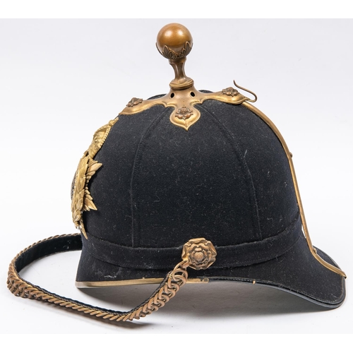 302 - An officer's blue cloth helmet of the Army Service Corps, with brass mounts including ball top, and ... 