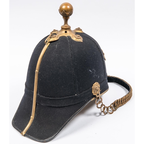 302 - An officer's blue cloth helmet of the Army Service Corps, with brass mounts including ball top, and ... 