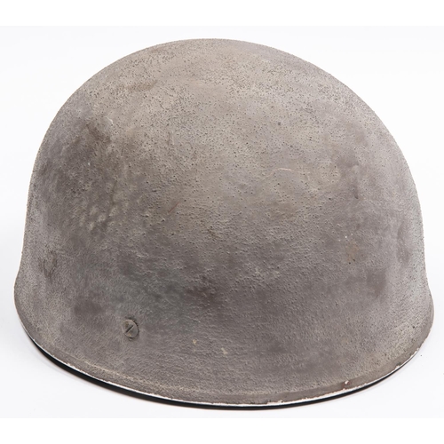 306 - A WWII British Airborne steel helmet, with webbing chinstrap, dated 1942, the skull with rough finis... 