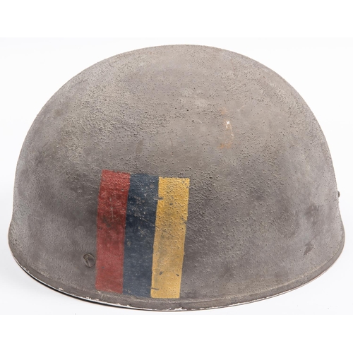 306 - A WWII British Airborne steel helmet, with webbing chinstrap, dated 1942, the skull with rough finis... 