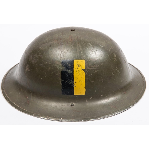 307 - A British WWII Mk 2 steel helmet, dated 1941, with painted regimental insignia. GC, purchased from a... 