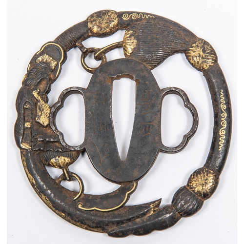 355 - A pierced iron tsuba, signed, and with gold decoration. GC, some wear to the gold. £50-100