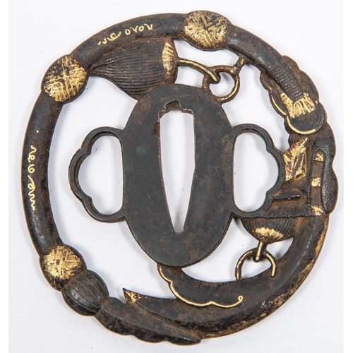 355 - A pierced iron tsuba, signed, and with gold decoration. GC, some wear to the gold. £50-100