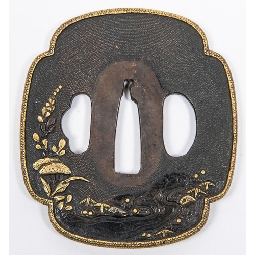 356 - A bronzed tsuba, of quatrefoil shape, with gold rim, embossed and overlaid with gold and silver flow... 