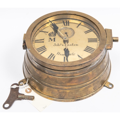 67 - An Imperial German ship's bulkhead clock, the brass face having black Roman numerals, maker's name 