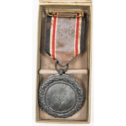 96 - A Third Reich Luftschutz Decoration 2nd class, with ribbon, and pin, in its box with printed lid; Mo... 