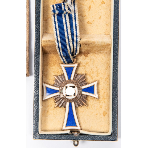 96 - A Third Reich Luftschutz Decoration 2nd class, with ribbon, and pin, in its box with printed lid; Mo... 