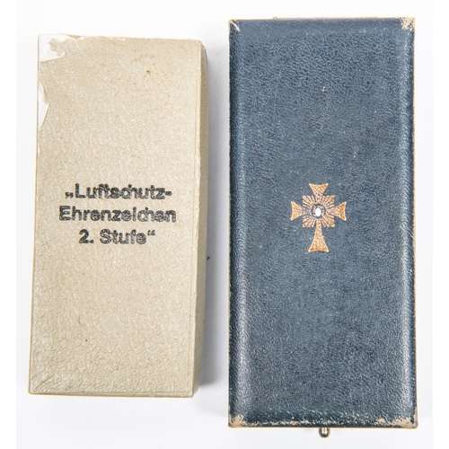 96 - A Third Reich Luftschutz Decoration 2nd class, with ribbon, and pin, in its box with printed lid; Mo... 