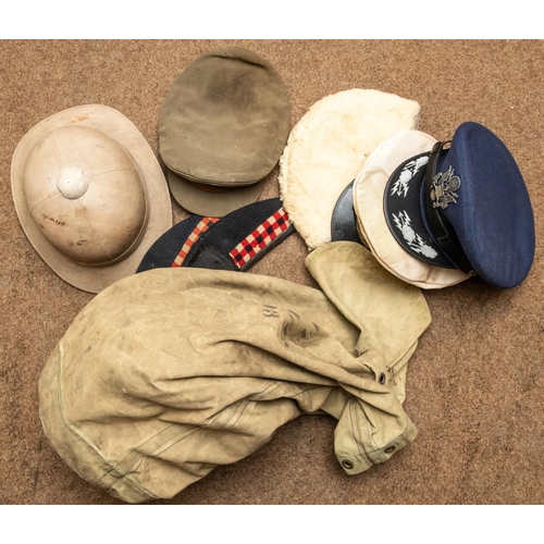 304 - A khaki tropical helmet; a Royal Artillery officer's SD cap; 2 glengarries; a WW US 1st Army officer... 