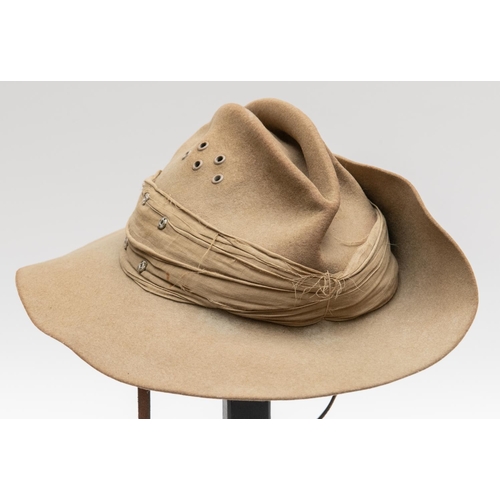 312 - A WWII British khaki slouch hat, khaki linen puggaree, leather chinstrap and lining, dated 1943. GC ... 