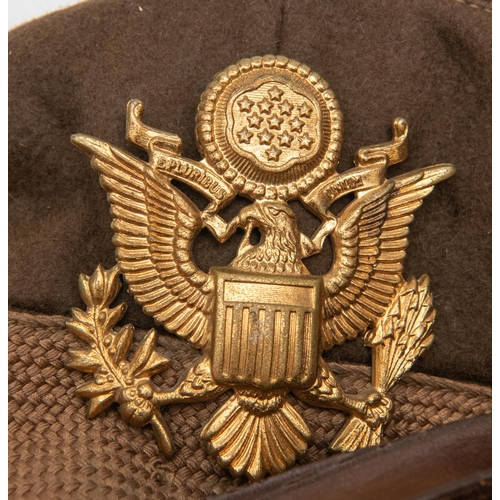 318 - A WWII US Army officers peaked SD cap, gilt badge, brown leather peak and  chinstrap. GC £70-75