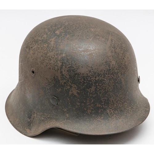 103 - A Third Reich Luftwaffe M43 raw edge steel helmet, decal on left side, complete with lining and chin... 