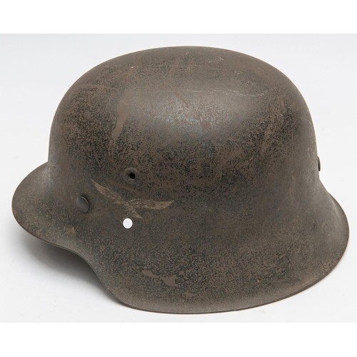 103 - A Third Reich Luftwaffe M43 raw edge steel helmet, decal on left side, complete with lining and chin... 