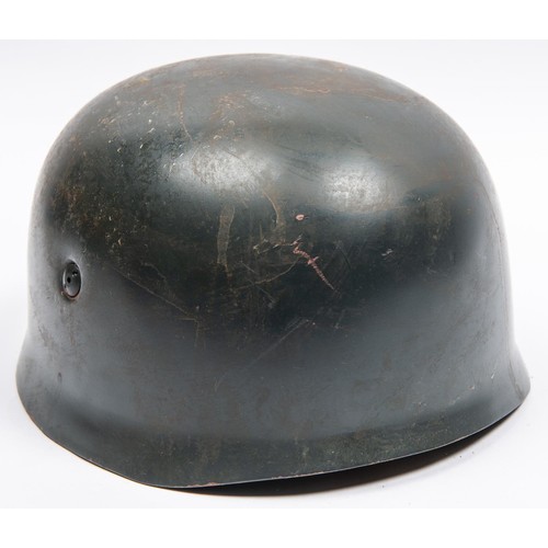 104 - A Third Reich parachutist helmet, with stamps to lining and Luftwaffe eagle decal. GC £500-550