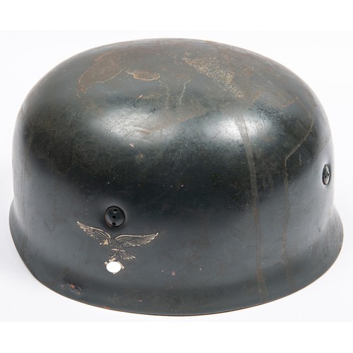 104 - A Third Reich parachutist helmet, with stamps to lining and Luftwaffe eagle decal. GC £500-550