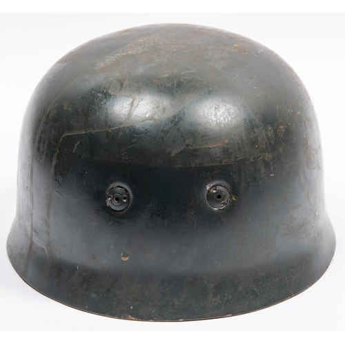 104 - A Third Reich parachutist helmet, with stamps to lining and Luftwaffe eagle decal. GC £500-550