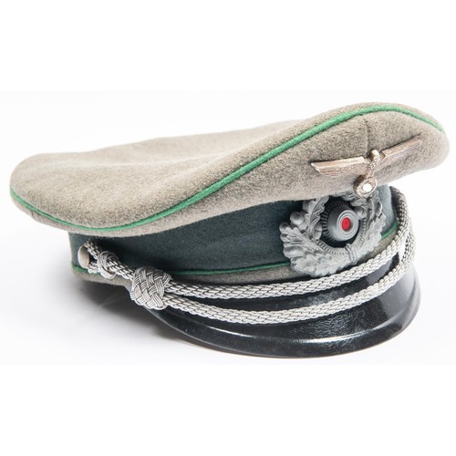 105 - A Third Reich Infantry officer's peaked cap, with metal insignia, silver bullion cords, and green pi... 