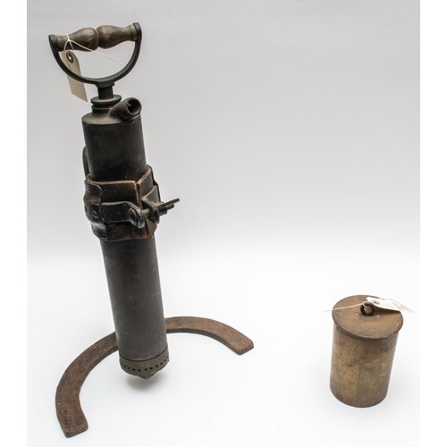 135 - A WWI Trench pump, complete with iron frame, also an 18pdr shell case adapted as a gas warning. GC £... 