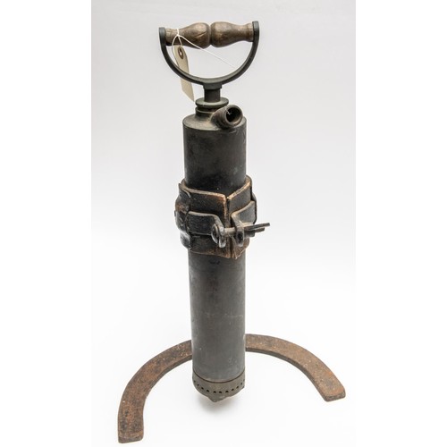 135 - A WWI Trench pump, complete with iron frame, also an 18pdr shell case adapted as a gas warning. GC £... 