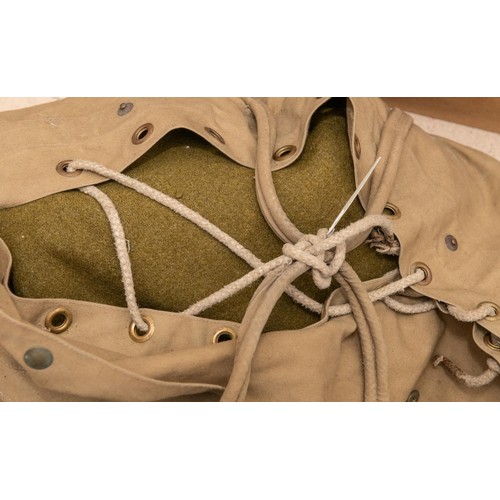 137 - A WWII cape ground sheet; a ground sheet; a pair of braces, webbing belt, leather gaiters; a US Army... 