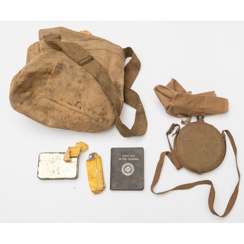 148 - A large WWI type medical orderlies khaki cloth haversack, filled with a large quantity of dressings,... 