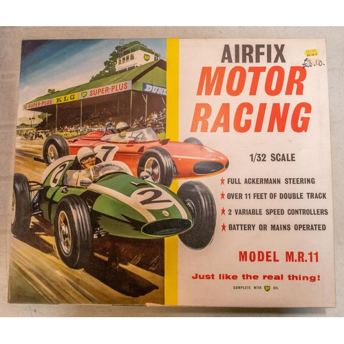 181 - A quantity of Airfix Motor Racing slot car system. Including a boxed set comprising 2x F1 cars; a Fe... 