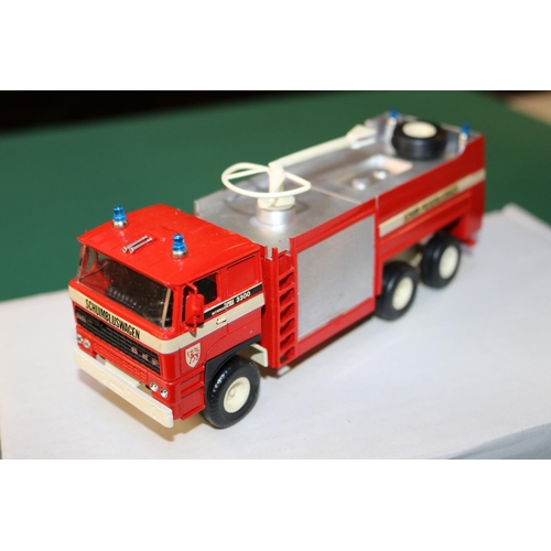 231 - An Alan Smith/Roxley Models Belgian Volvo 6x6 Airport Fire Truck. A white metal model finished in re... 