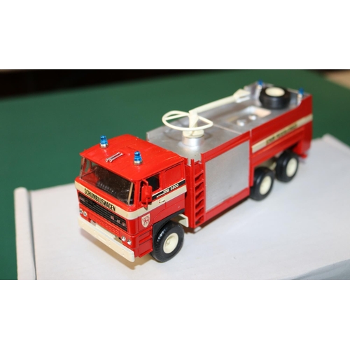 232 - An Alan Smith/Roxley Models Belgian DAF 3300 6x6 Airport Fire Truck. A white metal model finished in... 