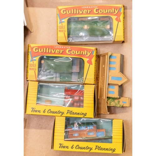 234 - 5 Lone star Gulliver Country OOO scale buildings. 4 are boxed and look unused and a loose church. Al... 