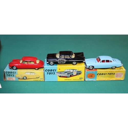 299 - 3 Corgi models. Citroen DS19 (210S), in red with yellow interior. Chevrolet 'State Patrol' (223), in... 