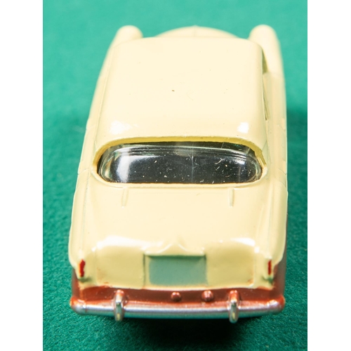 441 - Dinky Toys Singer Gazelle (168). In cream and dark brown with spun wheels. Boxed, complete with all ... 