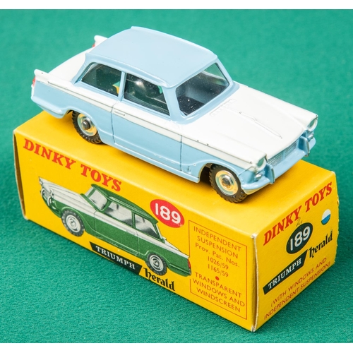 443 - Dinky Toys Triumph Herald (189). An example in light blue and white. Boxed. Vehicle VGC. 
A few smal... 