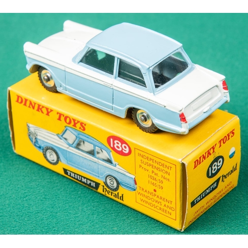 443 - Dinky Toys Triumph Herald (189). An example in light blue and white. Boxed. Vehicle VGC. 
A few smal... 