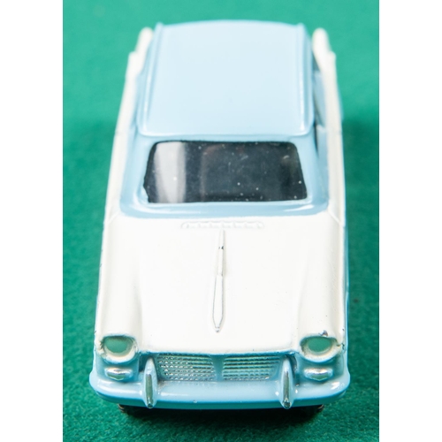 443 - Dinky Toys Triumph Herald (189). An example in light blue and white. Boxed. Vehicle VGC. 
A few smal... 