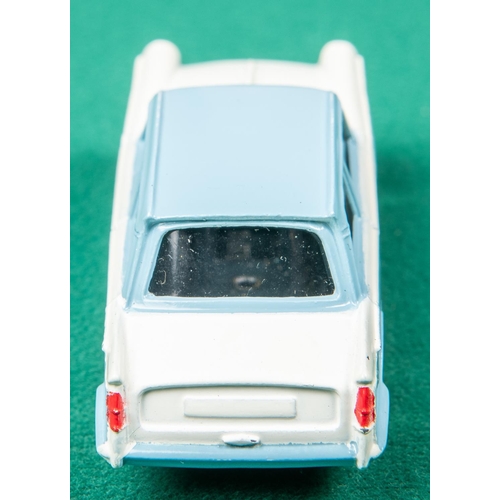 443 - Dinky Toys Triumph Herald (189). An example in light blue and white. Boxed. Vehicle VGC. 
A few smal... 