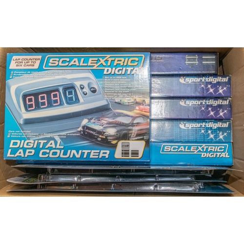 86 - A large quantity of Scalextric track packs and accessories. Includes Scalextric digital lap counter,... 