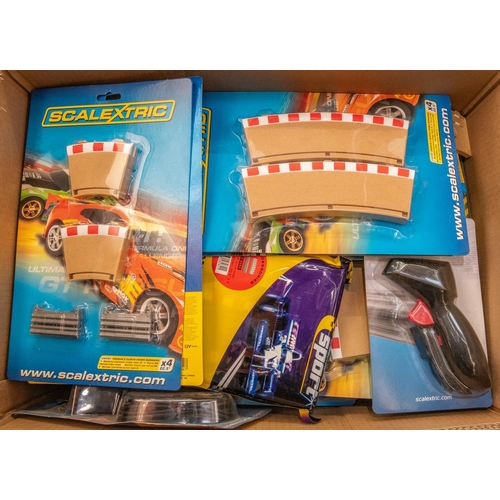 86 - A large quantity of Scalextric track packs and accessories. Includes Scalextric digital lap counter,... 