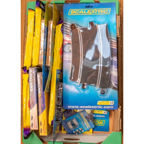 86 - A large quantity of Scalextric track packs and accessories. Includes Scalextric digital lap counter,... 