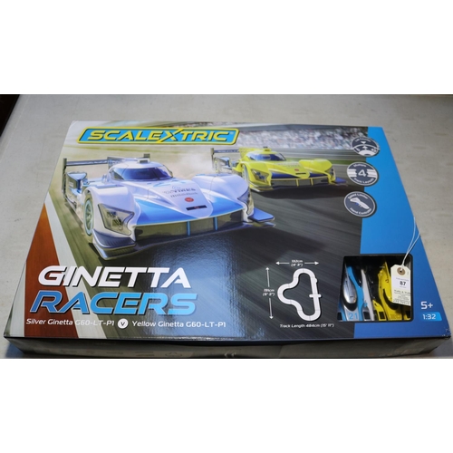 87 - Scalextric Ginetta Racers 1:32 scale. Contains a silver Ginetta G60-LT-P1, and a yellow Ginetta G60-... 