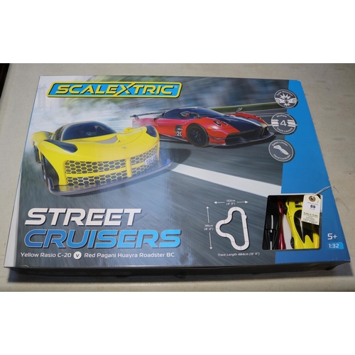 89 - Scalextric street racers 1:32 scale. Set contains a yellow Rasio C-20 and a red Pagani Huayra roadst... 