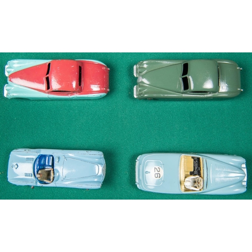 309 - 4 Dinky Toys. 2x Jaguar XK120 in dark green with light brown wheels and in turquoise and cerise with... 